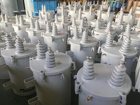 Group of distribution transformers with bushings